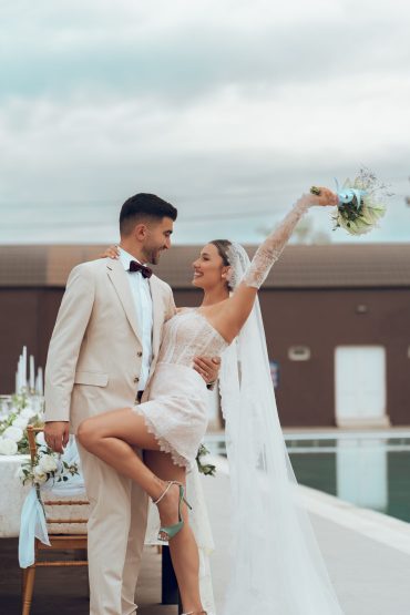 A newlywed couple celebrating joyfully